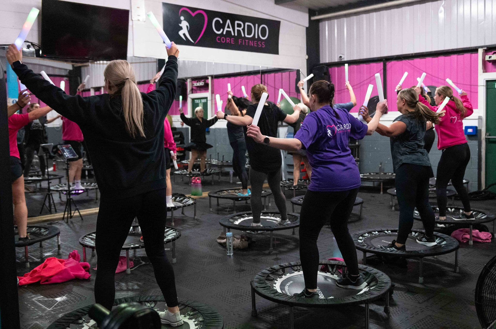 A packed Cardio Core Fitness rebound class in full swing